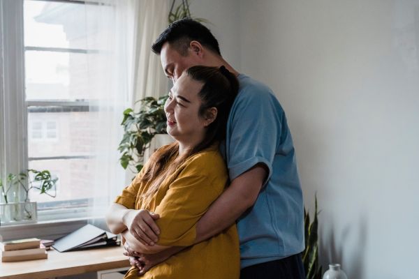 couple hugging in the living room